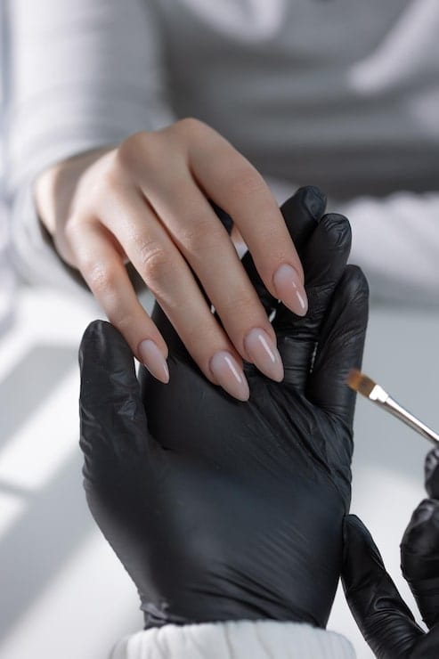 Gel polish being applied to a client's nails