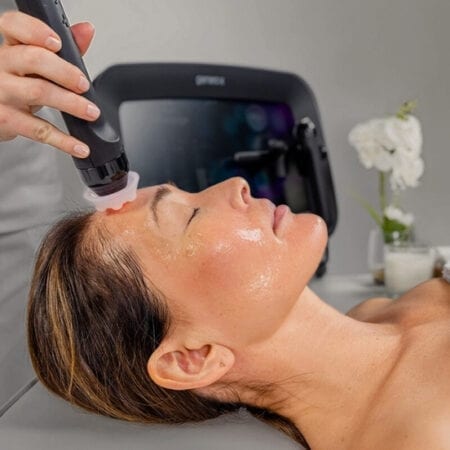 Client receiving a hydrating facial treatment Client receiving a hydrating facial treatment